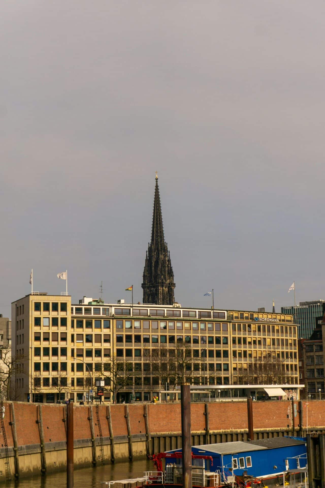 St. Nicholas' Church Spire Over Hamburg Buildings