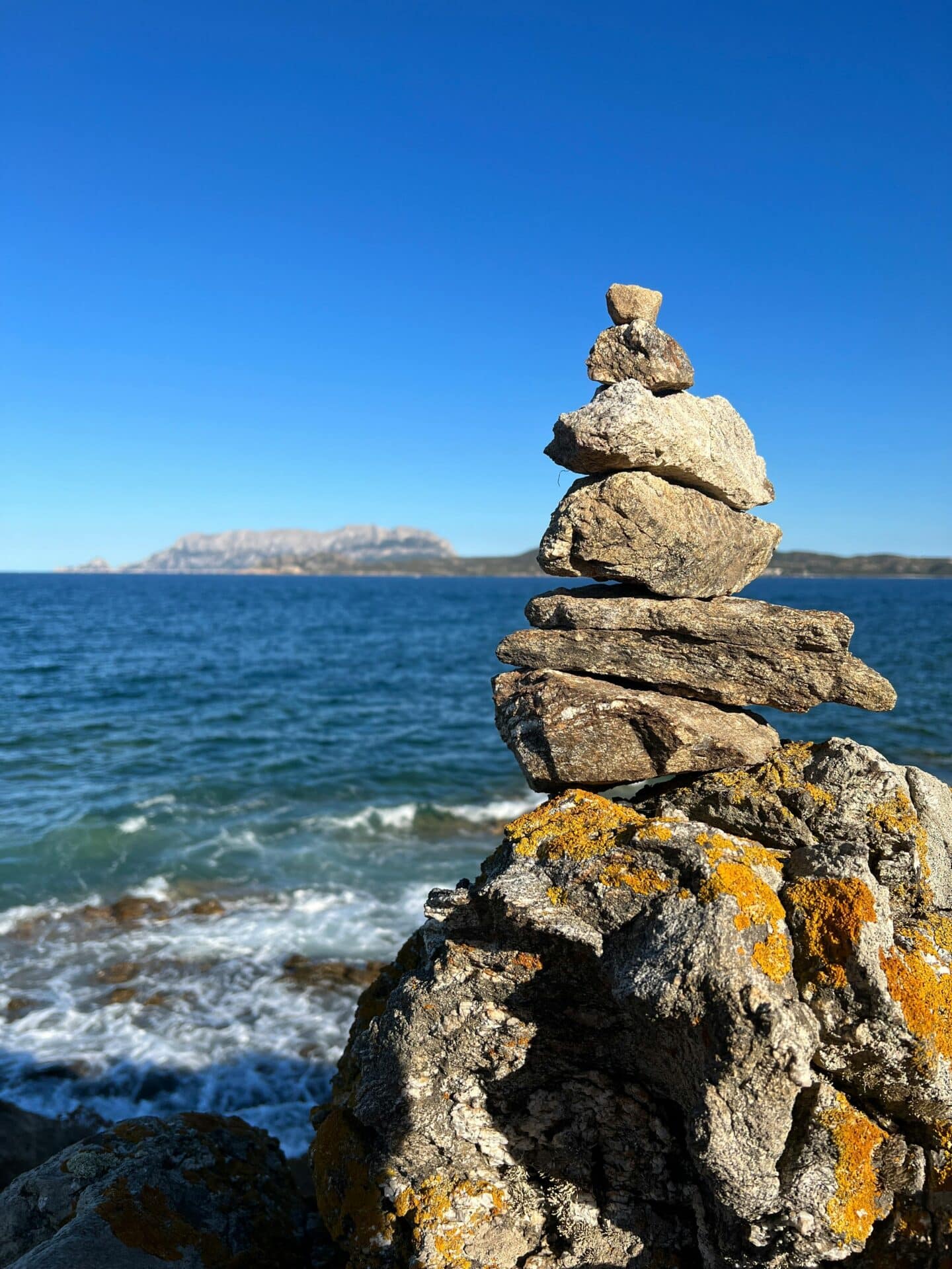 Stacked Rocks with Tavolara Island View